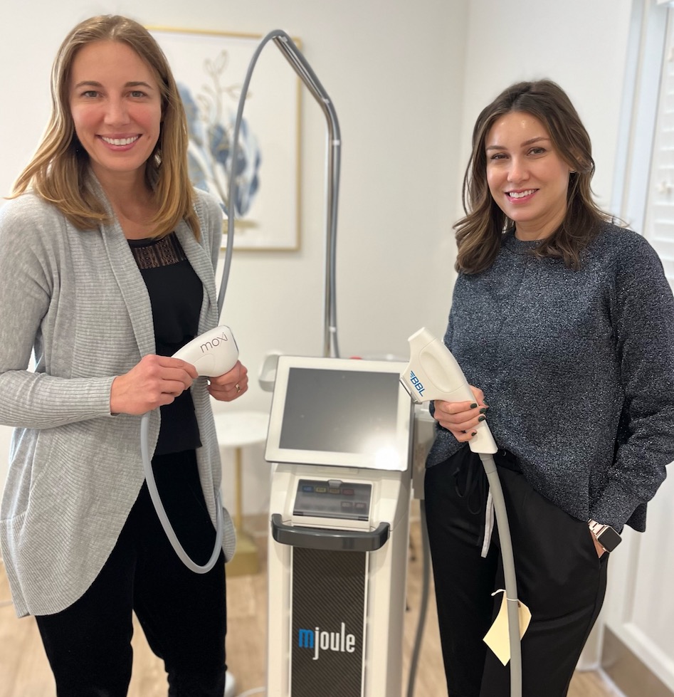 Mindy Jacques, MD and Eve Suiter LPN, LE hold the hand pieces of the MOXI and BBL lasers.